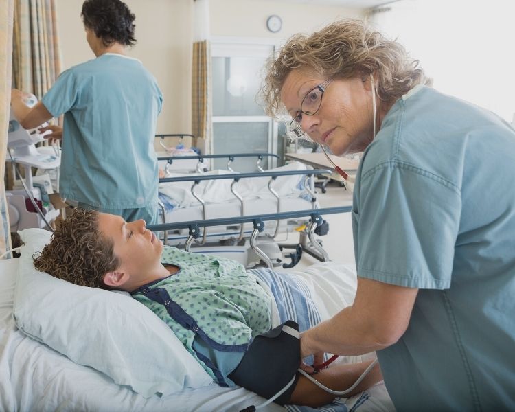 PACU nurse and patient