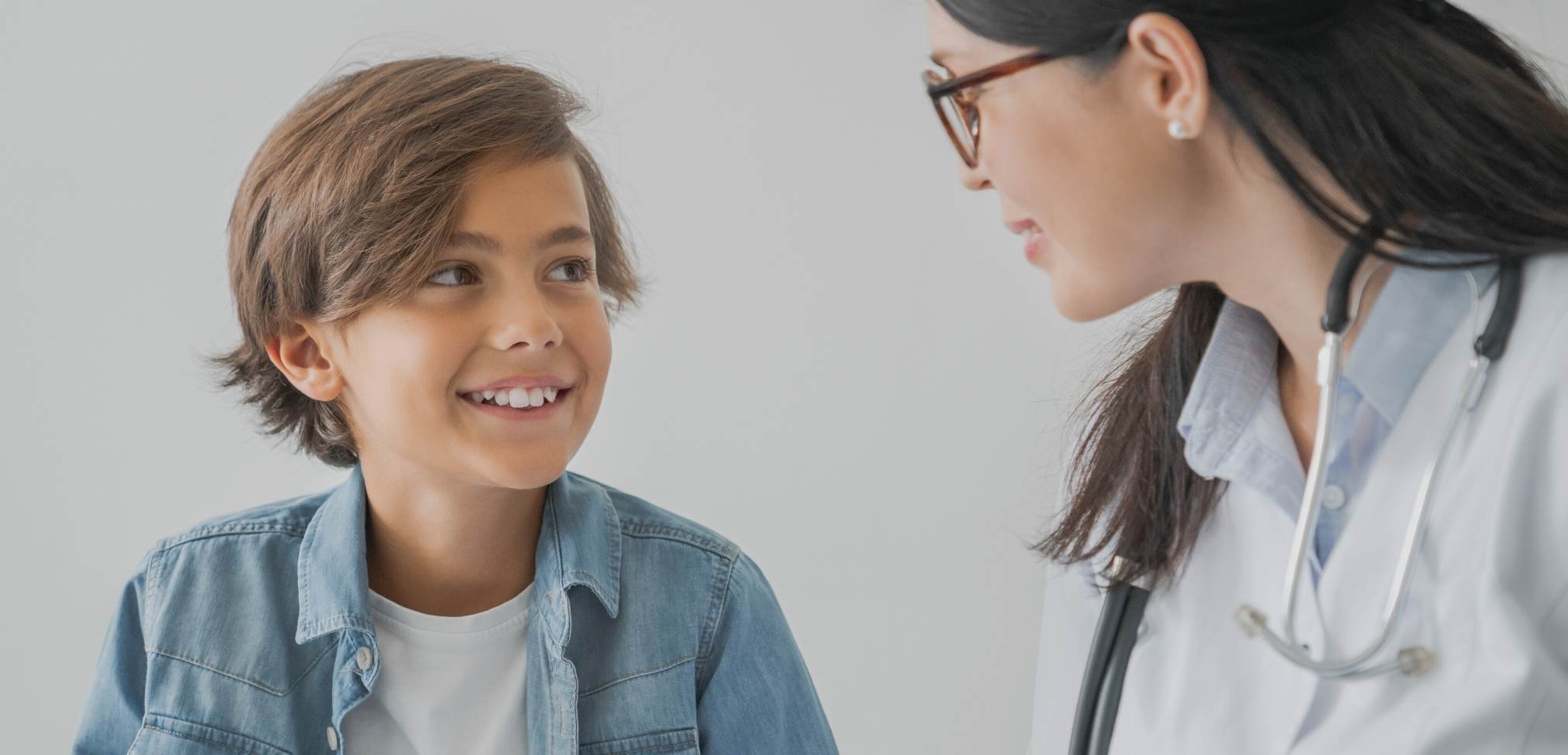 school nurse and child talking