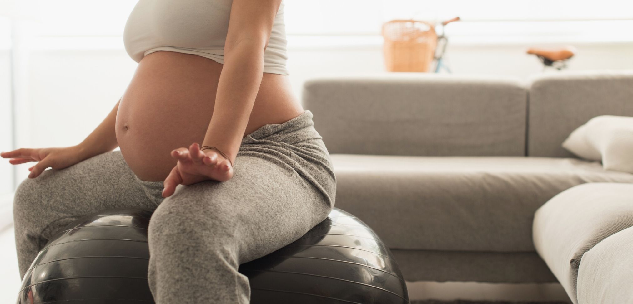 woman in labor using labor ball