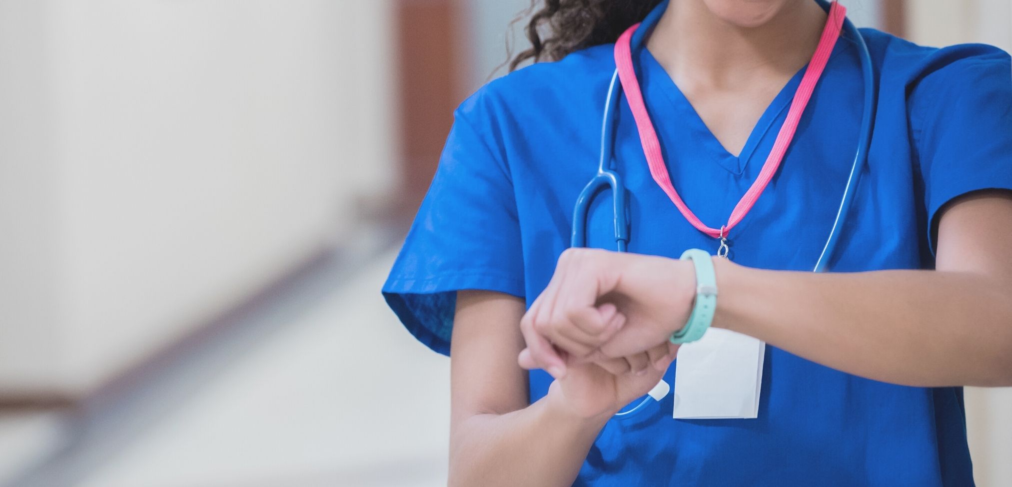 nurse checking watch