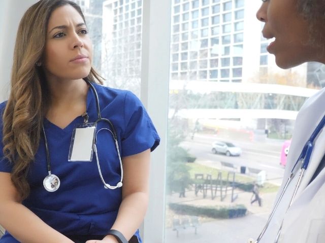 nurse being talked to by superior