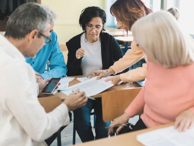 group of adult learners in classroom