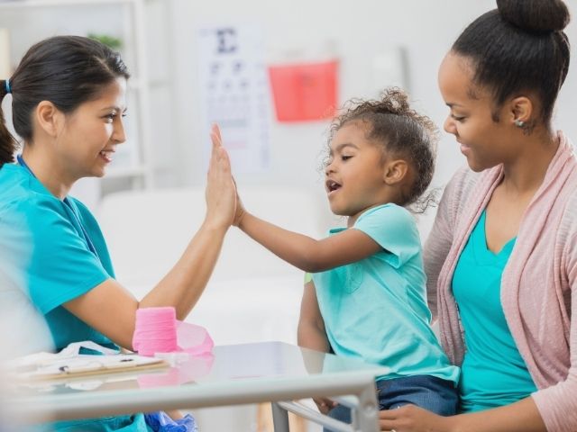 nurse with patient and parent