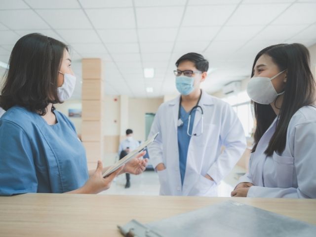 nurse and team talking