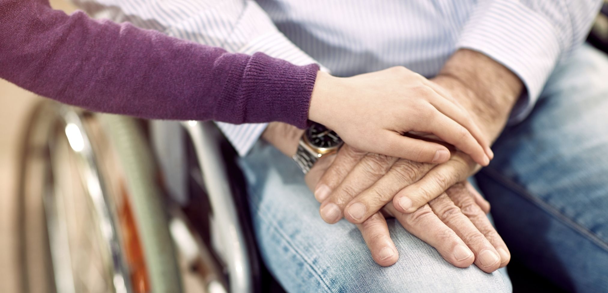 special needs nursing holding hands with patient